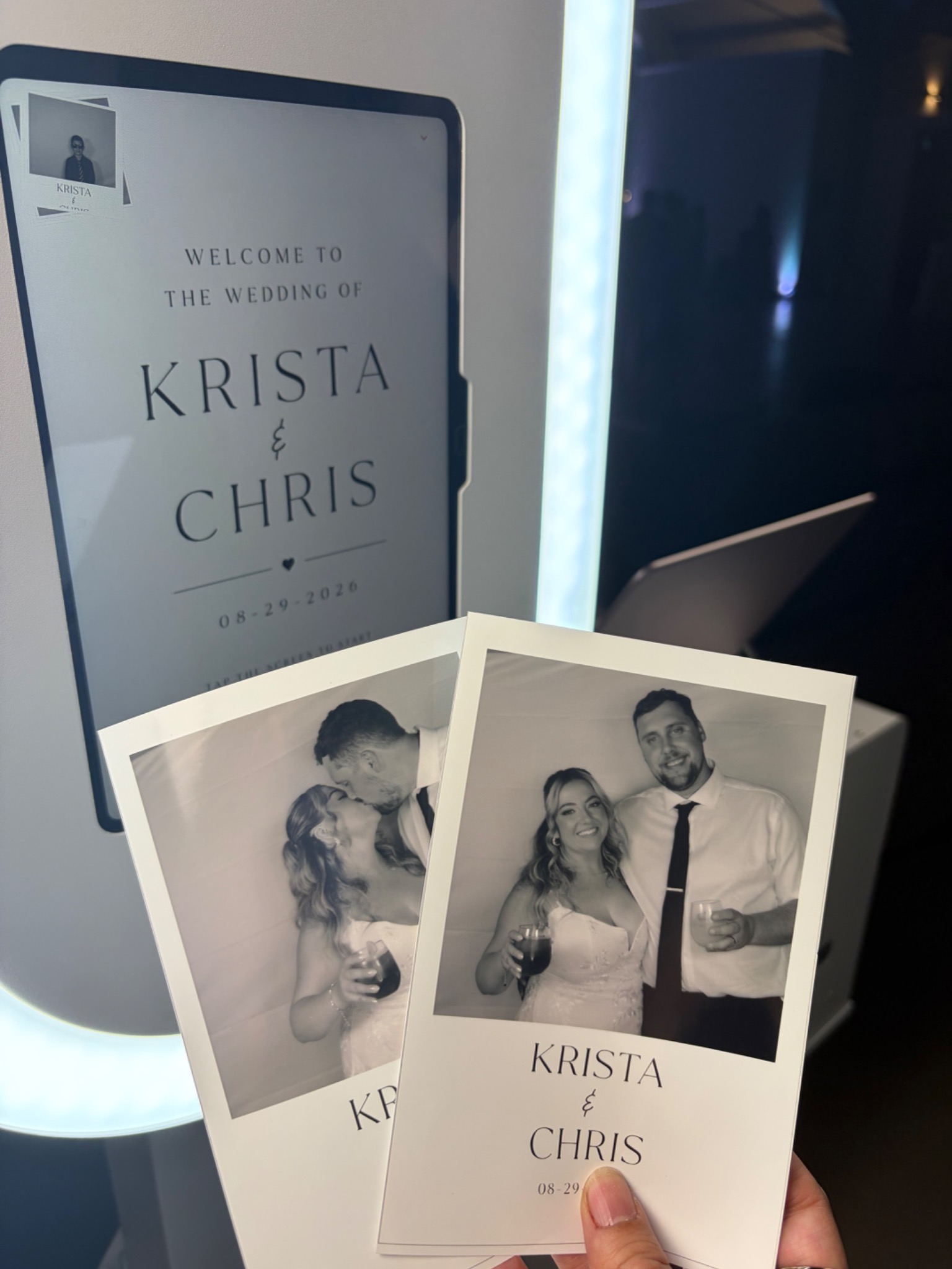 Krista and Chris wedding photo prints beside the Party Pixel booth